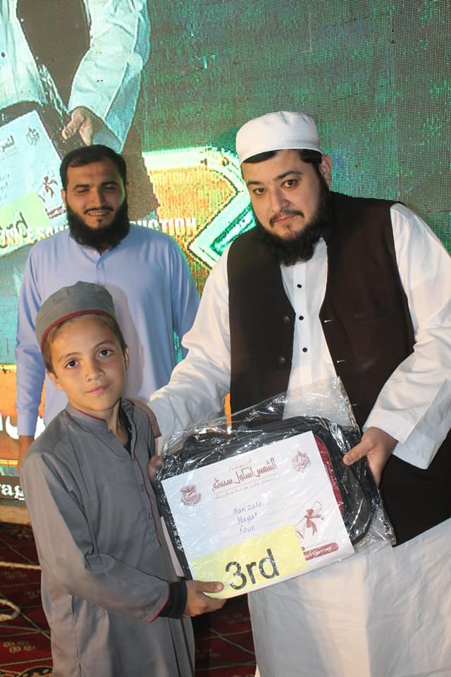 Person holding a green plant